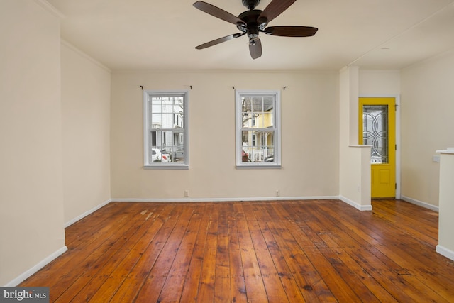 unfurnished room with hardwood / wood-style floors and ceiling fan