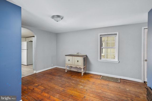 empty room featuring hardwood / wood-style floors