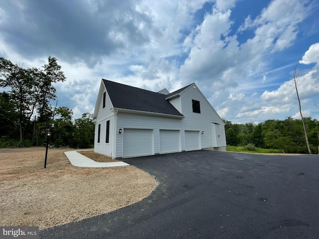 view of property exterior with a garage