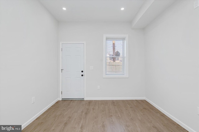 spare room with light wood-type flooring