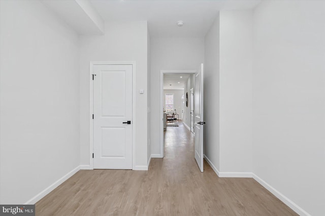 hall with light wood-type flooring