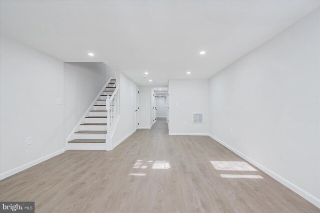 unfurnished living room featuring light hardwood / wood-style flooring