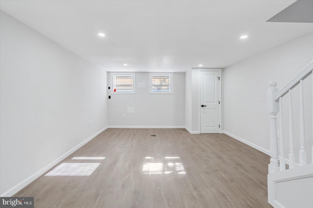 basement with light hardwood / wood-style floors