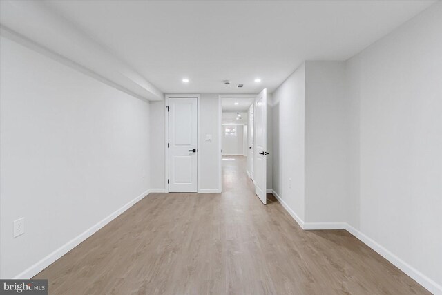 corridor featuring light hardwood / wood-style floors