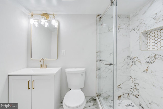 bathroom featuring vanity, an enclosed shower, and toilet