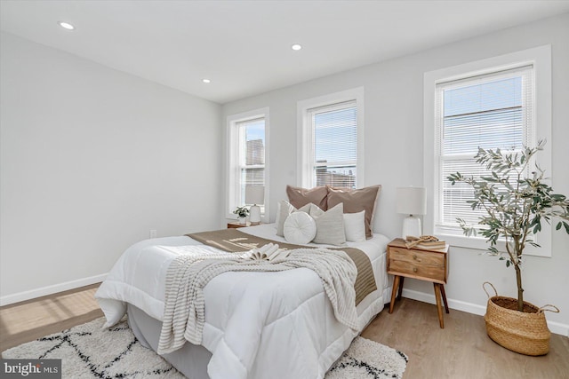 bedroom with light hardwood / wood-style flooring