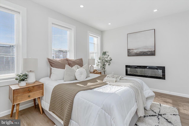 bedroom with hardwood / wood-style floors