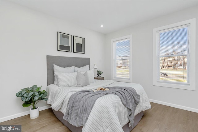 bedroom with wood-type flooring