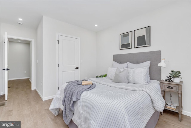 bedroom with light wood-type flooring