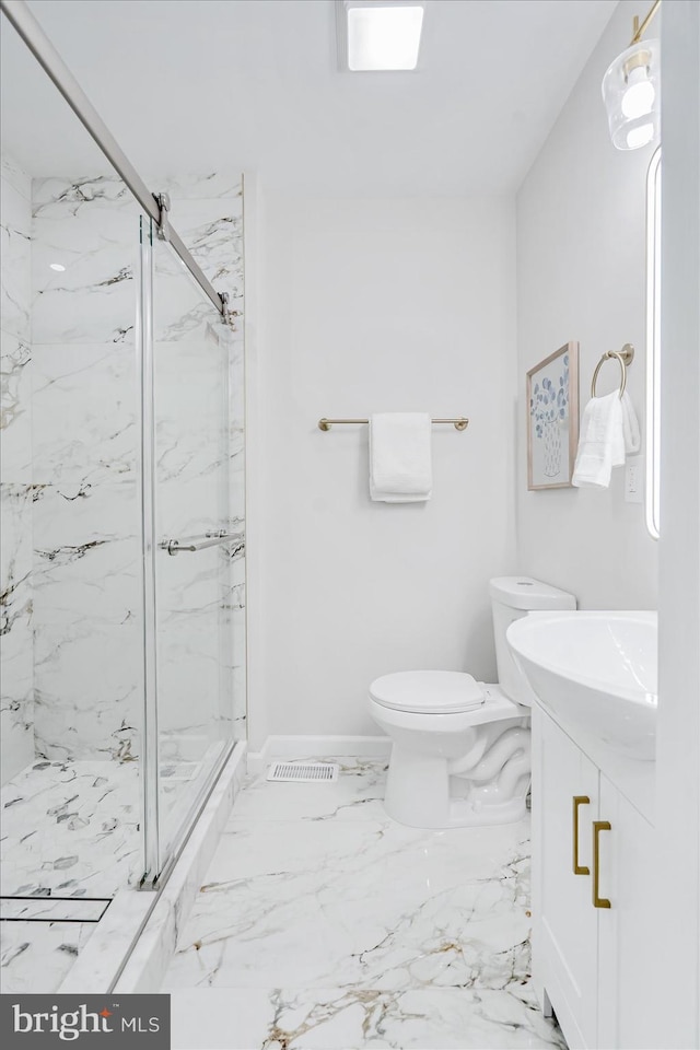 bathroom with vanity, toilet, and an enclosed shower