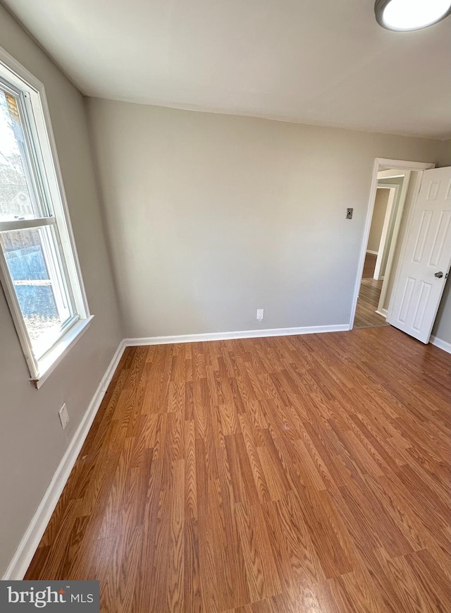 empty room featuring hardwood / wood-style flooring