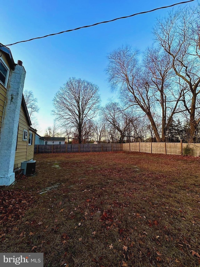 view of yard featuring central AC