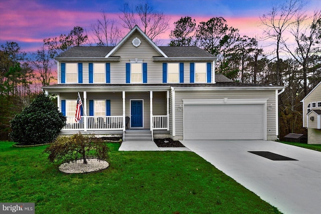 colonial inspired home with a lawn and covered porch