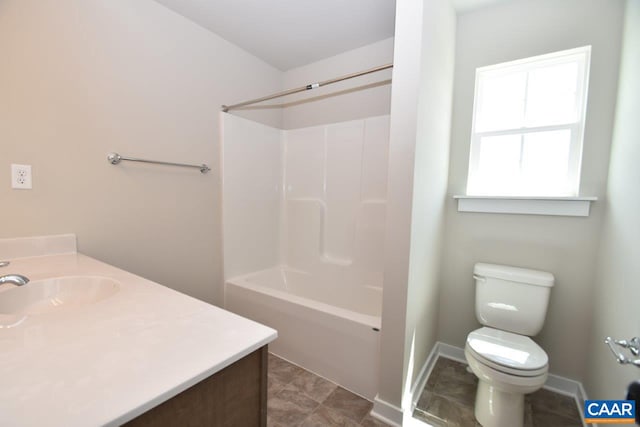 full bathroom with vanity, washtub / shower combination, and toilet