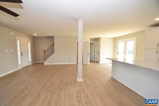 unfurnished living room with light hardwood / wood-style floors