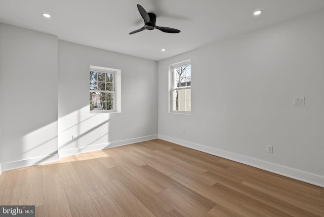 spare room with recessed lighting, ceiling fan, baseboards, and wood finished floors