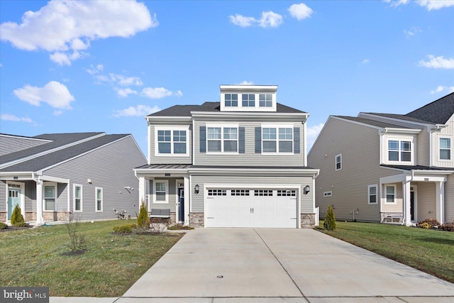 view of front of property with a front yard and a garage