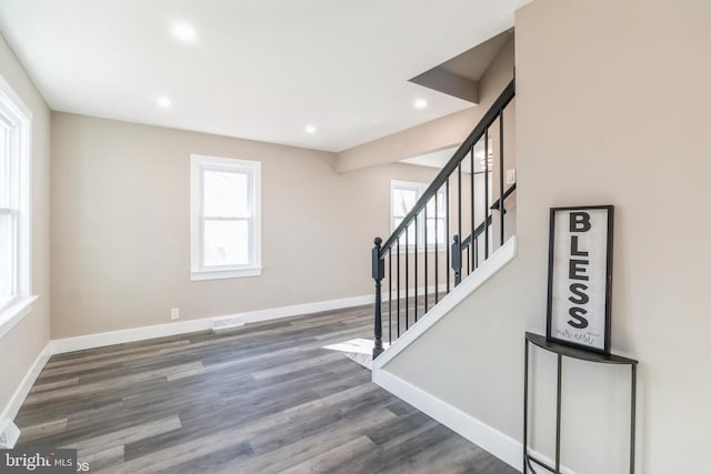 stairs with hardwood / wood-style flooring