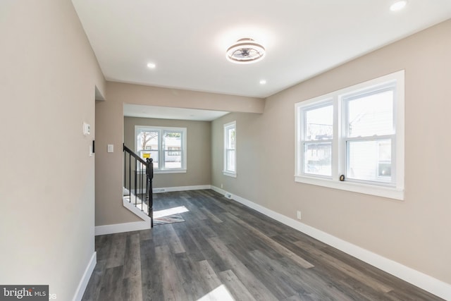 empty room with dark hardwood / wood-style floors