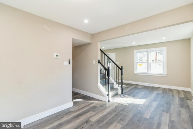 stairway featuring hardwood / wood-style floors