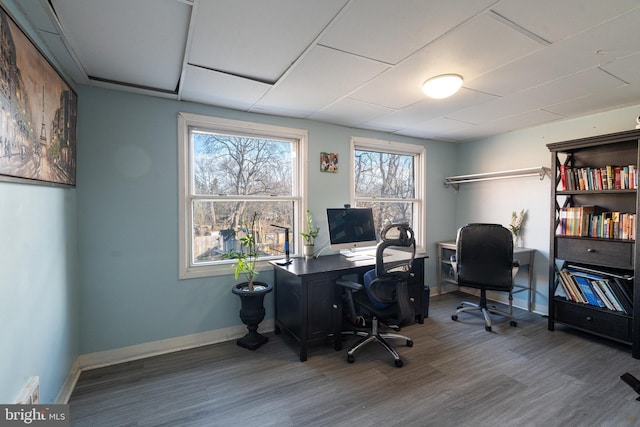 home office with plenty of natural light and wood-type flooring