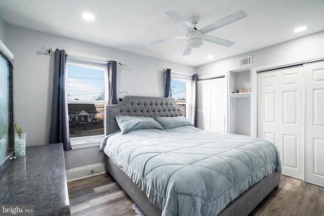 bedroom with ceiling fan and dark hardwood / wood-style floors