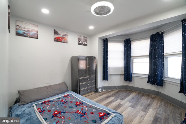 bedroom with hardwood / wood-style floors