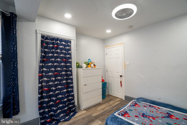 bedroom featuring dark hardwood / wood-style flooring