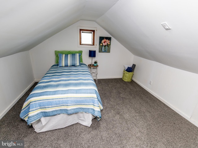 bedroom featuring lofted ceiling and carpet floors