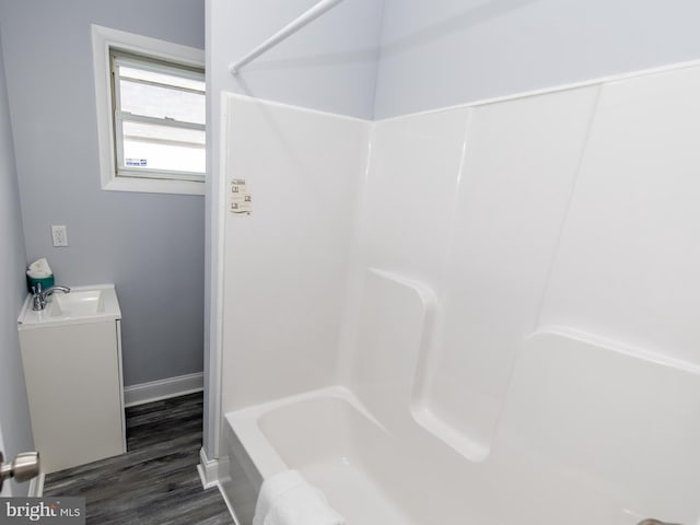 bathroom with hardwood / wood-style floors and vanity