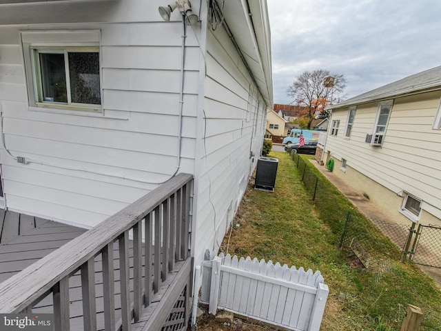 view of side of property with central AC and cooling unit