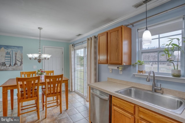 kitchen with dishwasher, sink, decorative light fixtures, and a notable chandelier