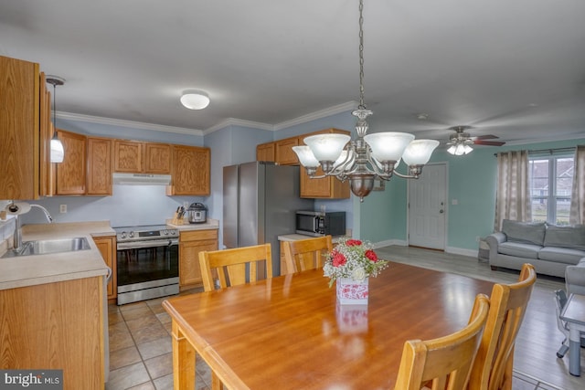 tiled dining room with ceiling fan with notable chandelier, crown molding, and sink