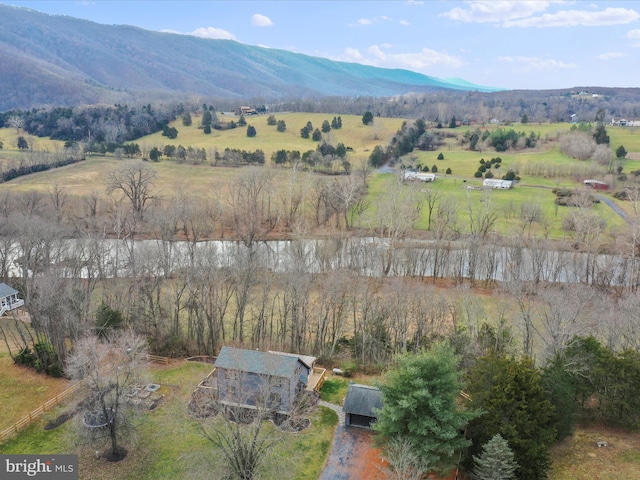 drone / aerial view with a mountain view and a rural view