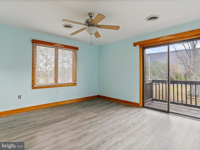 unfurnished room with ceiling fan and light hardwood / wood-style flooring