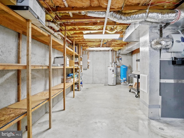 basement featuring heating unit and water heater