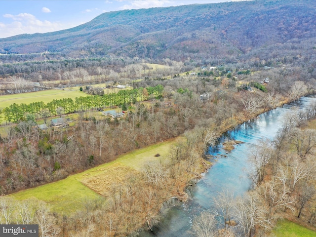 drone / aerial view with a water and mountain view