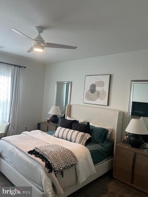 carpeted bedroom featuring ceiling fan