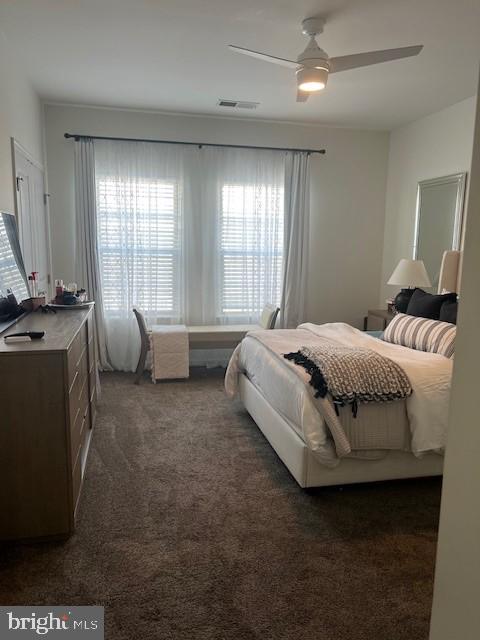 carpeted bedroom featuring ceiling fan