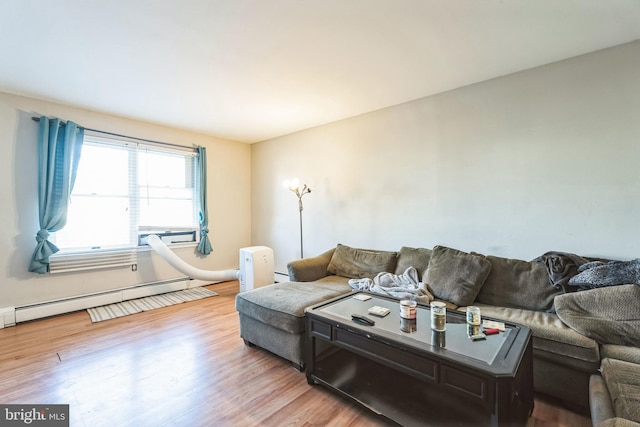 living room featuring light wood-type flooring and baseboard heating