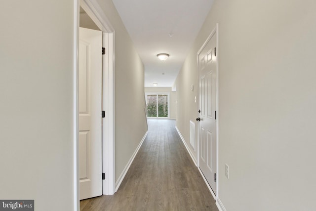 hall with light hardwood / wood-style flooring