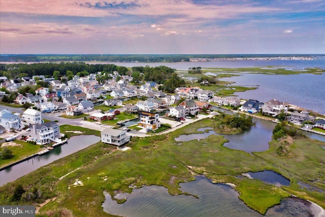 aerial view at dusk with a water view