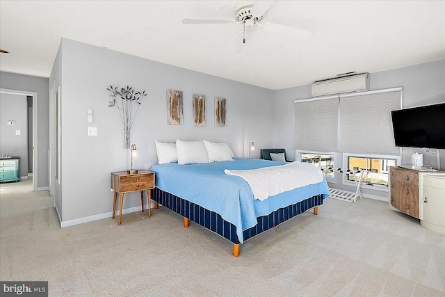 carpeted bedroom featuring a wall unit AC and ceiling fan