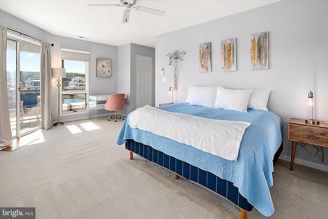 bedroom with access to outside, ceiling fan, a closet, and light colored carpet