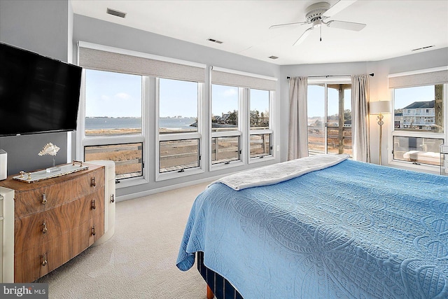 bedroom featuring ceiling fan and light carpet