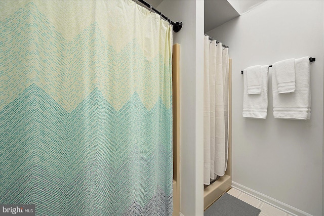 bathroom featuring tile patterned flooring and curtained shower