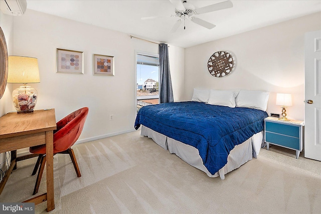 carpeted bedroom featuring ceiling fan and a wall unit AC