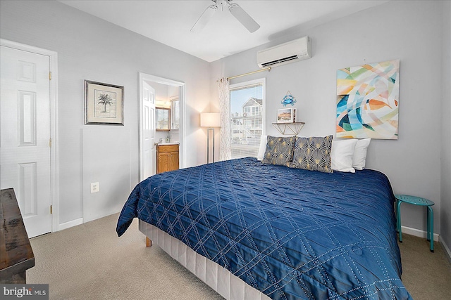 carpeted bedroom featuring connected bathroom, ceiling fan, and a wall mounted air conditioner