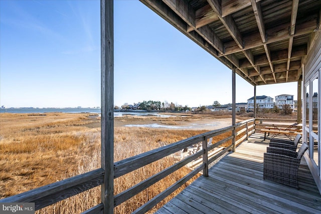 deck featuring a rural view and a water view