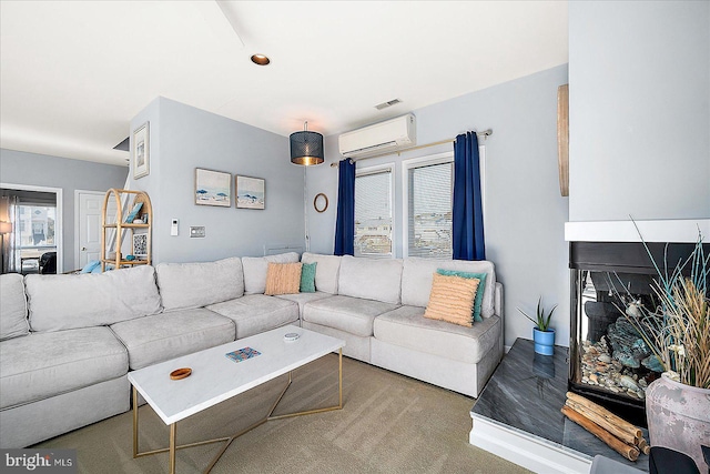 carpeted living room with a wall mounted air conditioner and a multi sided fireplace